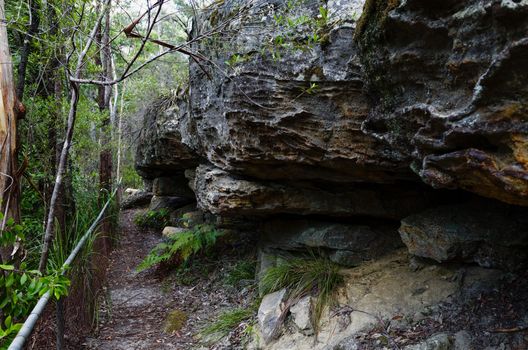 The fence trail passing rugged rock formations at Hazelbrook, Blue Mountains, Australia.