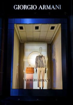 SYDNEY, AUSTRALIA, MAY 26, 2015;  One of the retail shop window displays in Martin Place, a mannequin wearing womens clothing and accessories - visual merchandising of Giorgio Armani, Sydney