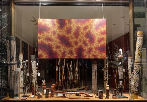 SYDNEY, AUSTRALIA - MAY 27, 2015;  Retail shop window display at Circular Quay Sydney where tourists and locals can buy handcrafted aboriginal objects such as didgeridoos , woomeras and paintings