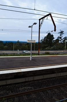 Hazelbrook Blue Mountains Australia railway station and Great Western Highway at dusk.