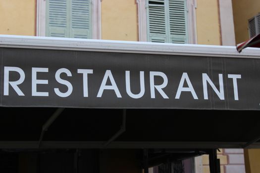 Restaurant signboard in the street - Menton, France