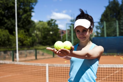 Girl playing tennis on the court