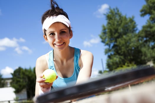 Girl playing tennis on the court