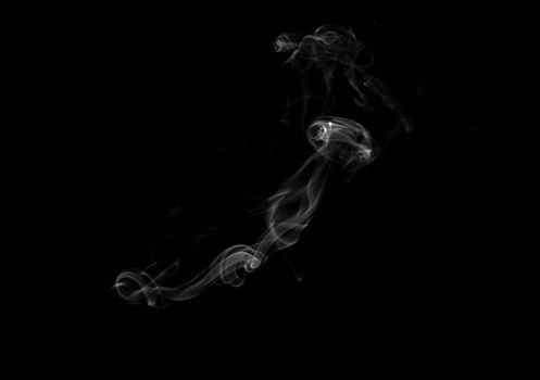 Swirls of smoke on a black background.