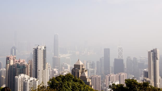 Top view of modern city in fog
