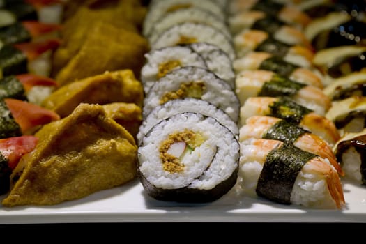 Japanese Cuisine -Buffet catering style Sushi Set in restaurant - salmon Maki Sushi and Nigiri Sushi