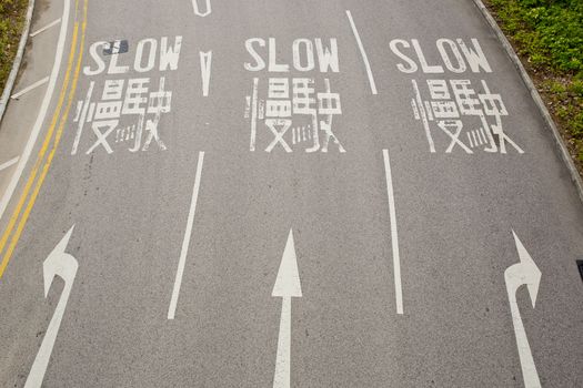 Bilingual (English and Chinese) Slow road sign for driver