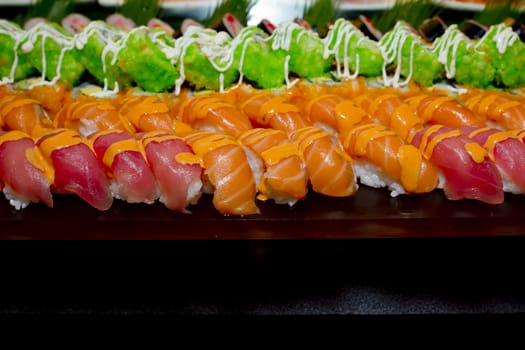 Japanese Cuisine -Buffet catering style Sushi Set in restaurant - salmon Maki Sushi and Nigiri Sushi