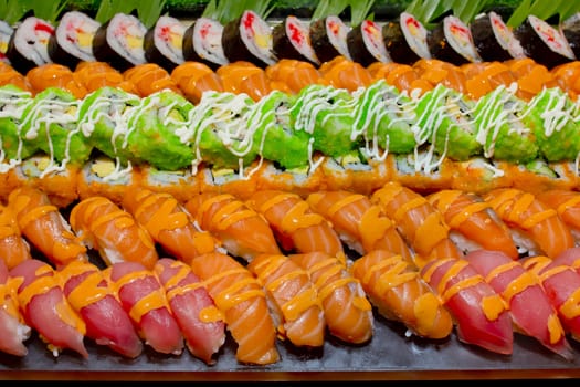 Japanese Cuisine -Buffet catering style Sushi Set in restaurant - salmon Maki Sushi and Nigiri Sushi
