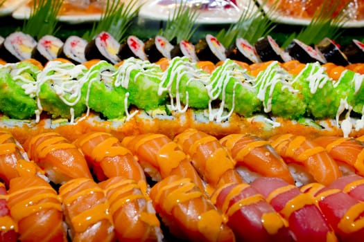 Japanese Cuisine -Buffet catering style Sushi Set in restaurant - salmon Maki Sushi and Nigiri Sushi