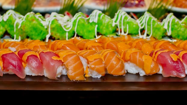Japanese Cuisine -Buffet catering style Sushi Set in restaurant - salmon Maki Sushi and Nigiri Sushi