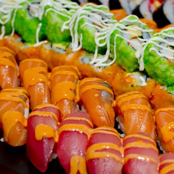 Japanese Cuisine -Buffet catering style Sushi Set in restaurant - salmon Maki Sushi and Nigiri Sushi