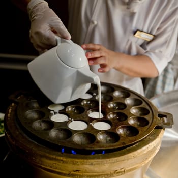 Kind of Thai sweetmeat. Coconut milk mix with powder fried dessert.