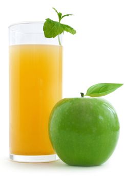 Glass of apple juice with a fresh apple over a white background