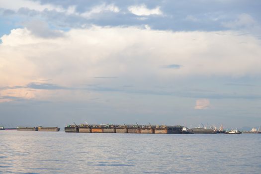Cargo ship. Parking in the sea to await transportation to the port.