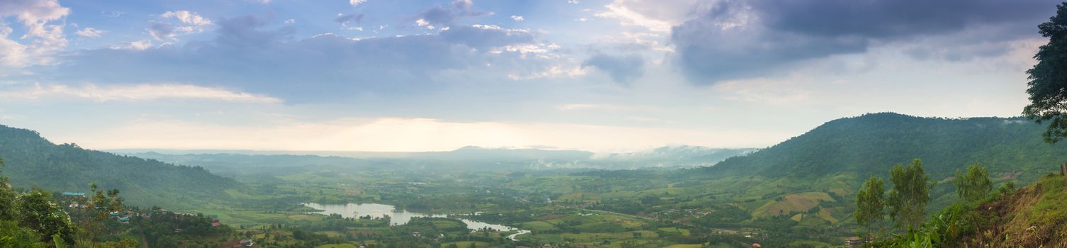 panorama mountains, forests and agricultural areas.Clouds covered the sky in the evening.