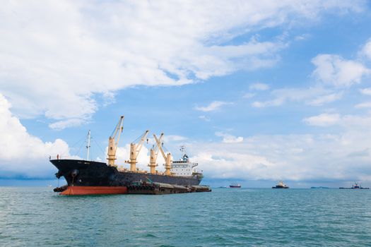 Cargo ship. Parking in the sea to await transportation to the port.