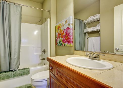 Nice bathroom with tile floors and full bath shower.