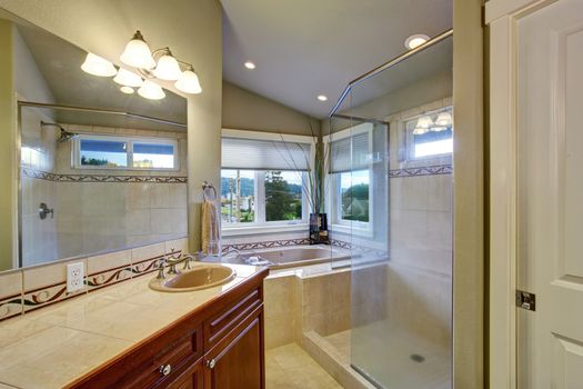 New bright and large bathroom with tile floor conected to master bedroom.