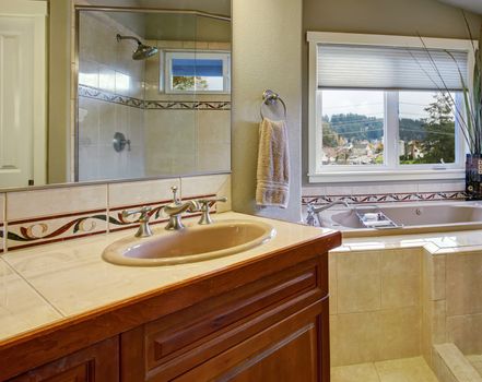 New bright and large bathroom with tile floor conected to master bedroom.