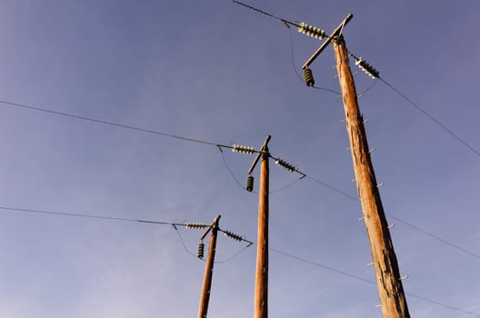 Photograph of electric poles on a sunny day in the Australian bush