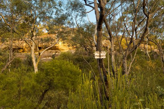 Photograph of Private property sign in the Australian Bush.