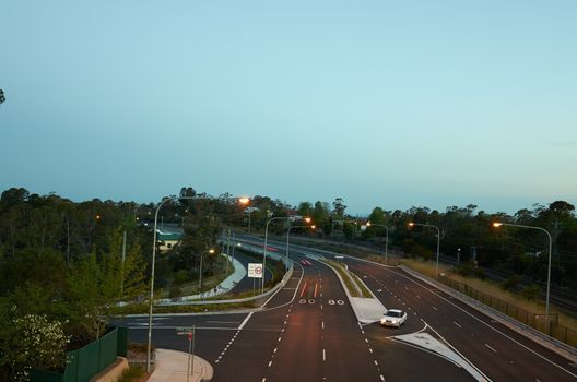 Cars driving at dusk on the newly updated Great Western Highway at Hazelbrook in the Blue Mountains, Australia