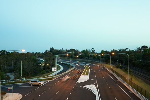 Cars driving at dusk on the newly updated Great Western Highway at Hazelbrook in the Blue Mountains, Australia