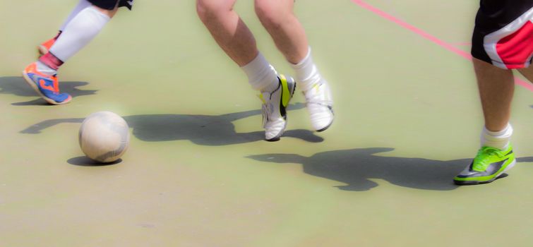 boys playing football in a local tournament