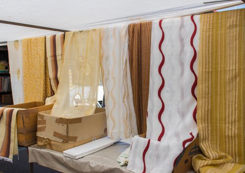 The colorful curtains are exposed in a sicilian market