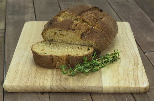 Loaf of wholemeal brown bread cut ready to serve