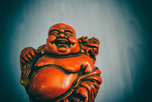 Photograph of a smiling Budha statue