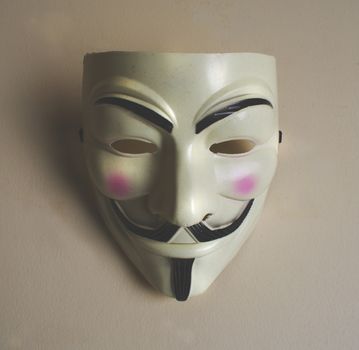 Photograph of a smiling man mask