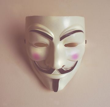 Photograph of a smiling man mask
