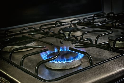 Photograph of a stove´s blue fire flame