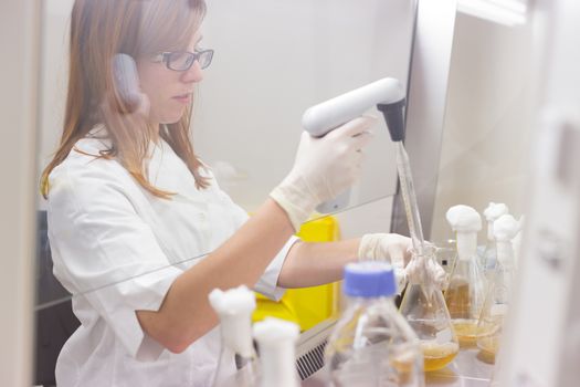 Life scientist researching in laboratory. Life sciences study living organisms on the level of microorganisms, viruses, human, animal and plant cells, genes, DNA...