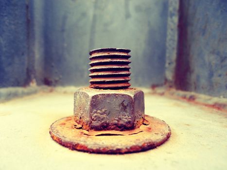 Photograph of an industrial metal rusty screw nad nut