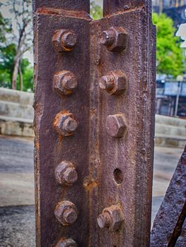 Photograph of some industrial rusty metal screws and nuts