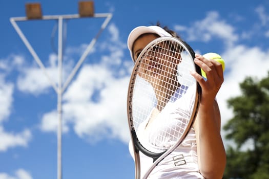 Woman playing tennis in summer