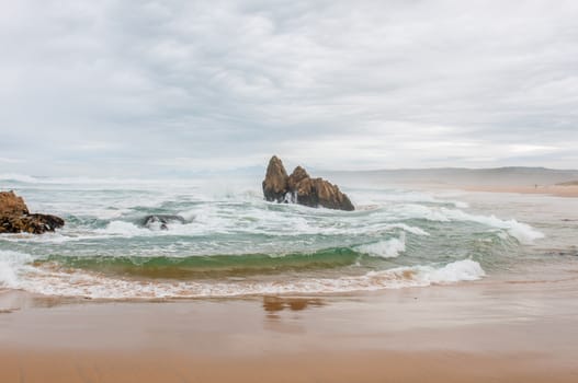 Stormy weather at a beach near Buffelsbaai (Buffalo Bay) at Knysna, South Africa