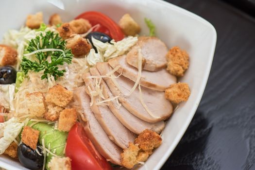 salad from ham crust cabbage, tomato cucumber olive greens and cheese 