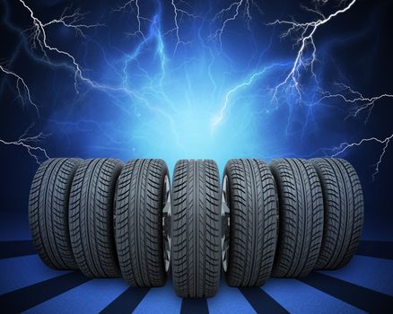 Wedge of new car wheels. Abstract blue background with lightning and stripes at bottom