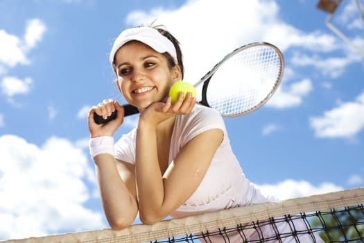 Woman playing tennis in summer