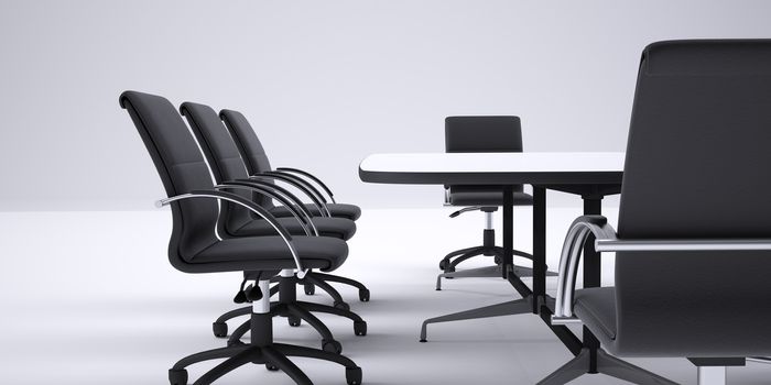 Conference table and black office chairs. Cropped image. Gray gradient background