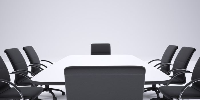Conference table and black office chairs. Cropped image. Gray background