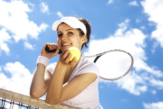 Woman playing tennis in summer