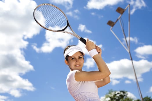 Young woman tennis player on the court