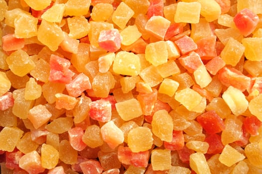 Dried pineapple and papaya pieces as an abstract background texture