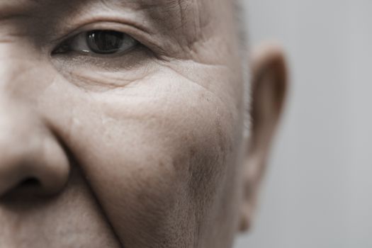 Face of elderly man looking at camera. Horizontal photo