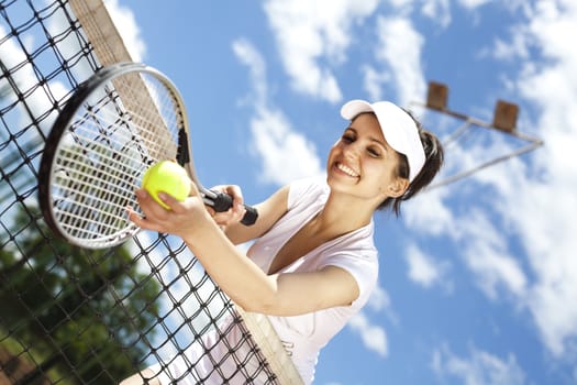 Young woman playing tennis, natural colorful tone